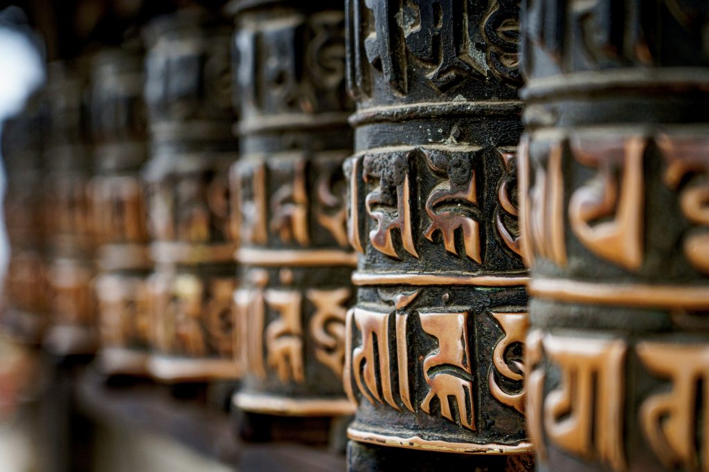 prayer wheels turning, sending out positive energy like news